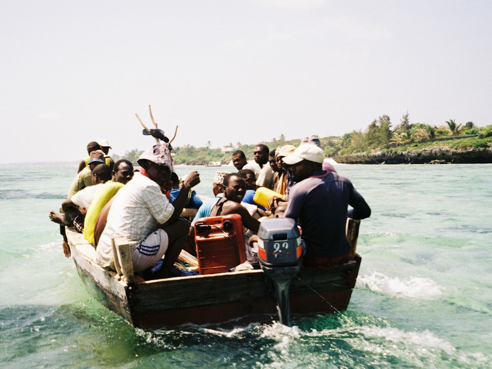 people riding on boat on water during daytime