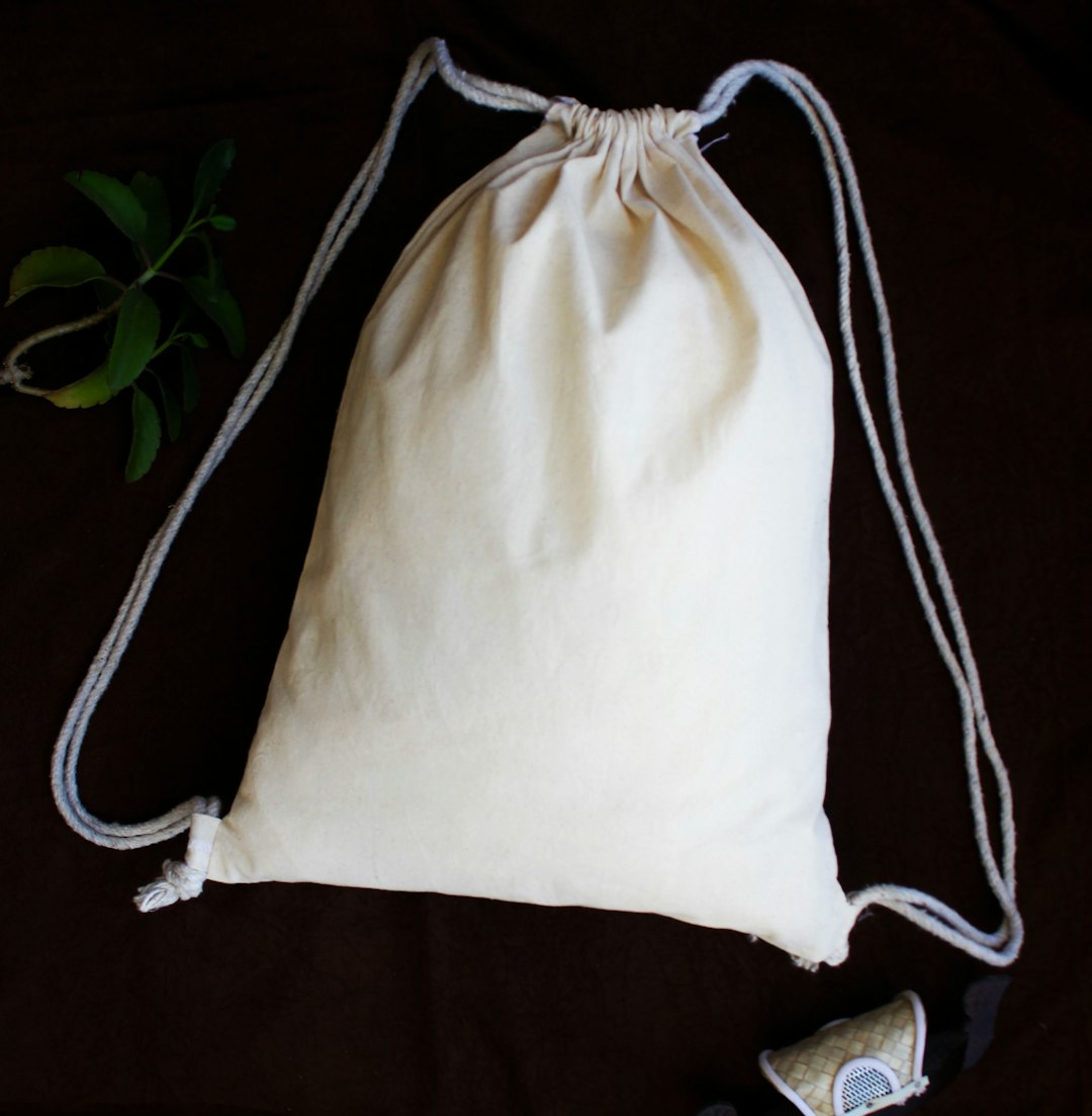  white and black sling bag sack