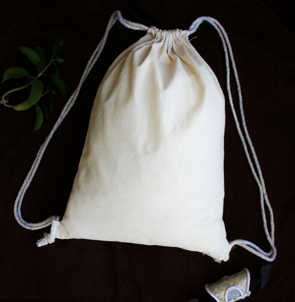 white and black sling bag