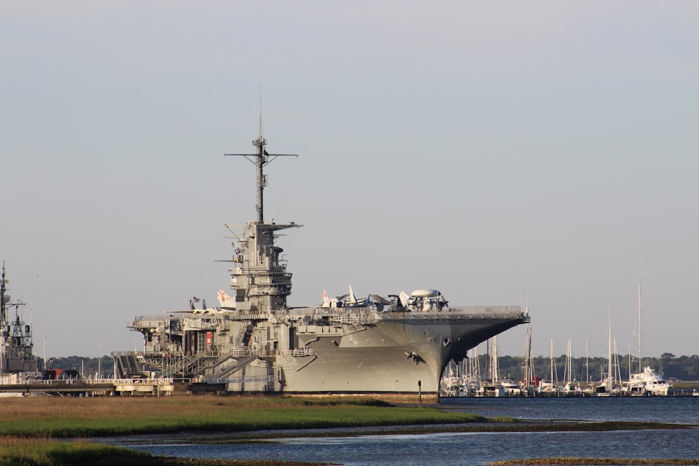 gray ship on sea under gray sky during daytime