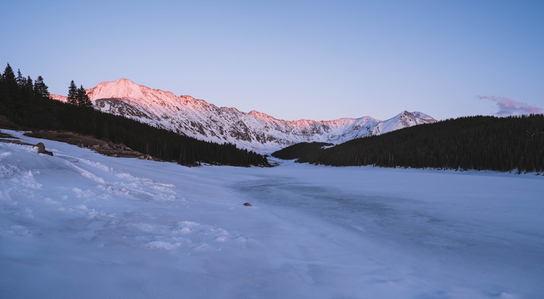 snow covered mountain during daytime