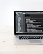 macbook pro on white table