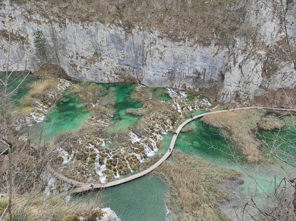 aerial view of river between rocky mountains during daytime