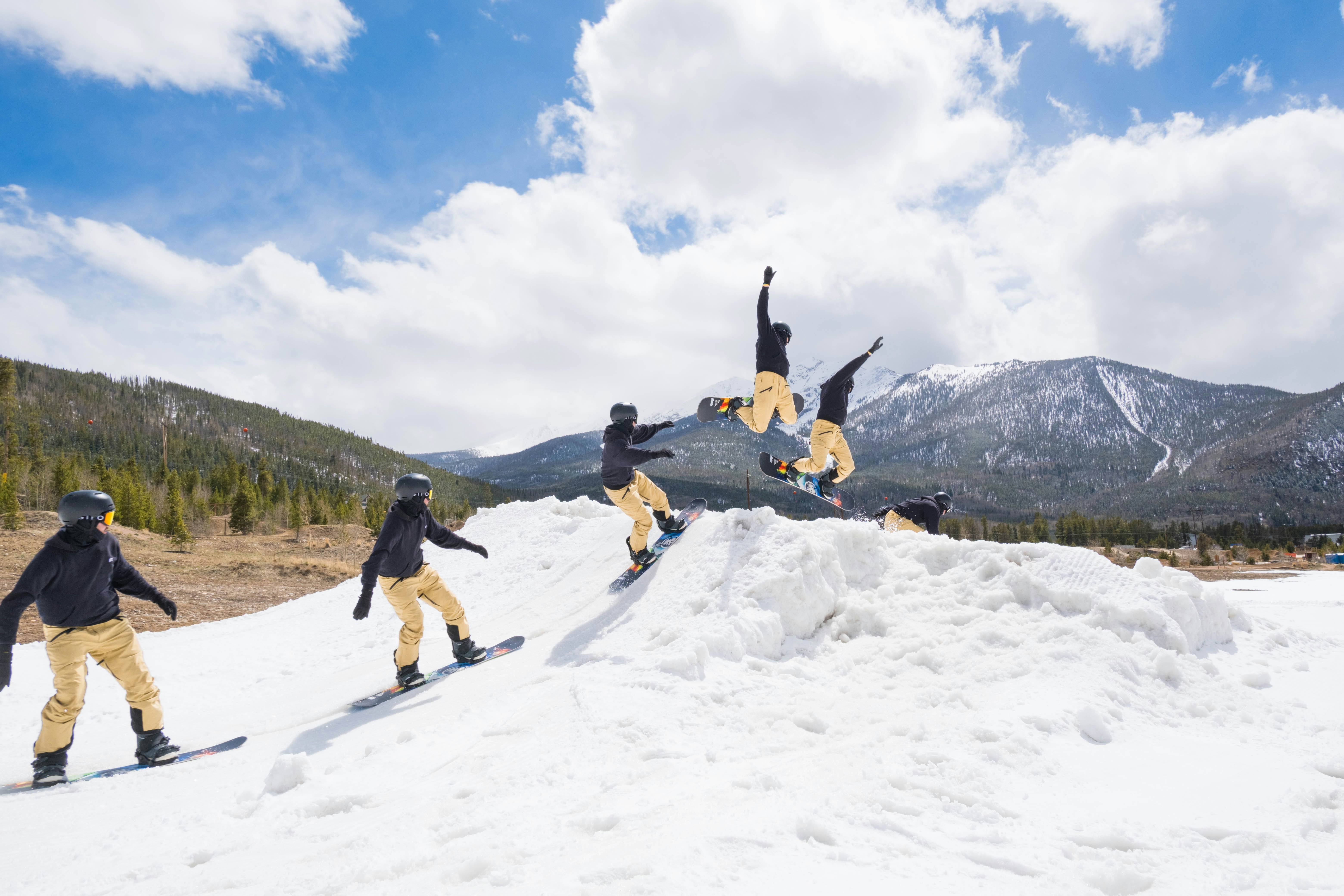 people playing on snow covered ground during daytime