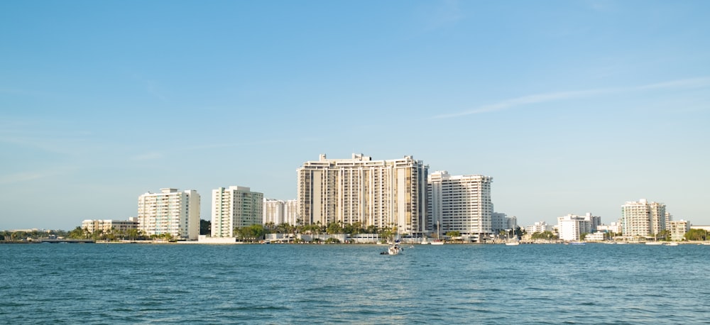 city skyline across body of water during daytime