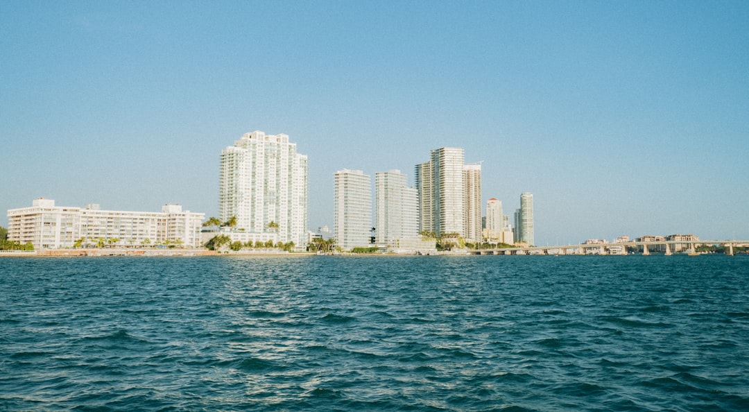 city skyline across body of water during daytime