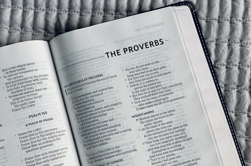 A Bible opened to the book of Proverbs.