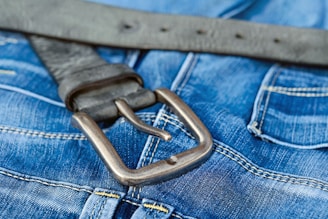 blue denim jeans with brown leather belt