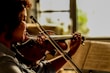 man playing violin during daytime
