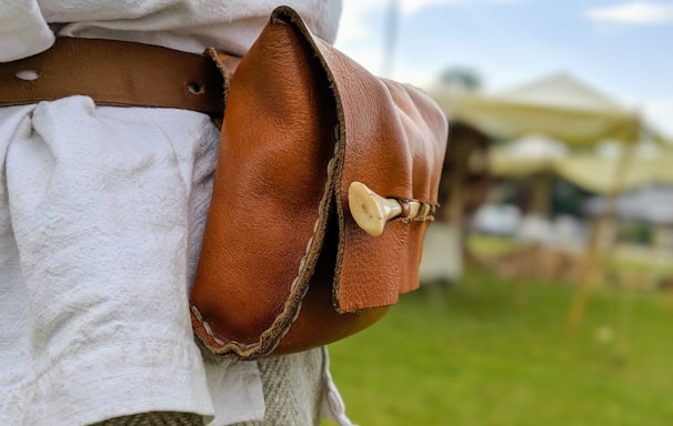 woman in brown leather shoulder bag