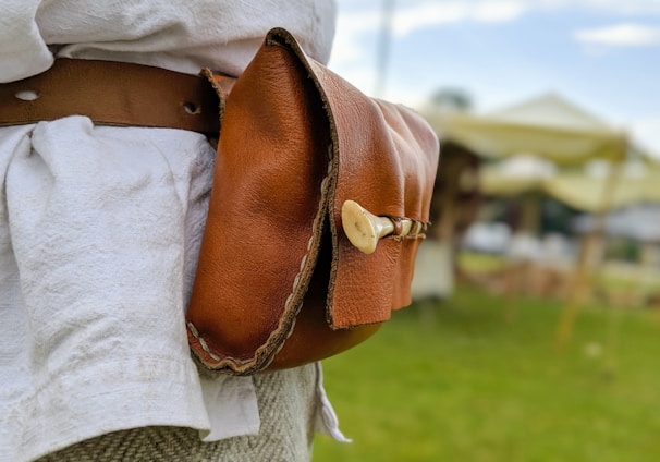 woman in brown leather shoulder bag