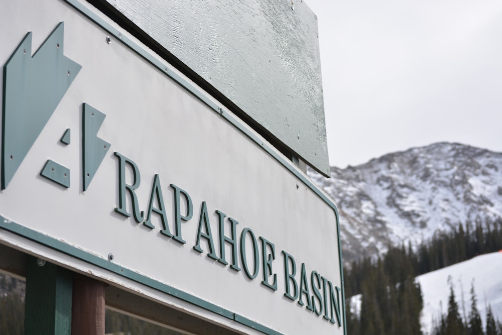 white and green wooden signage