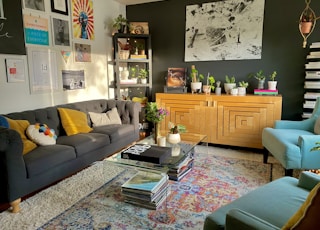 brown wooden cabinet near gray couch