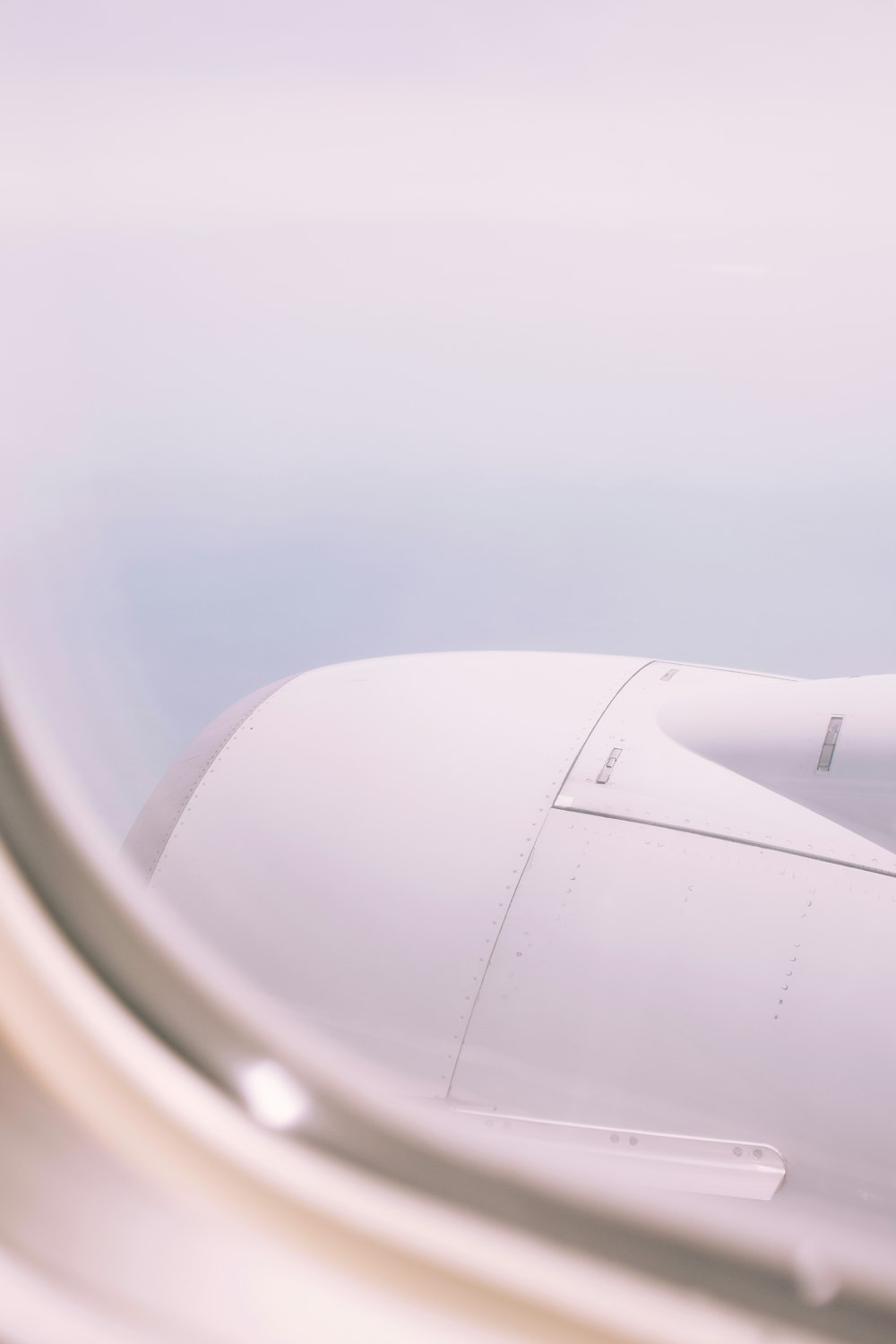 airplane window view of white clouds during daytime