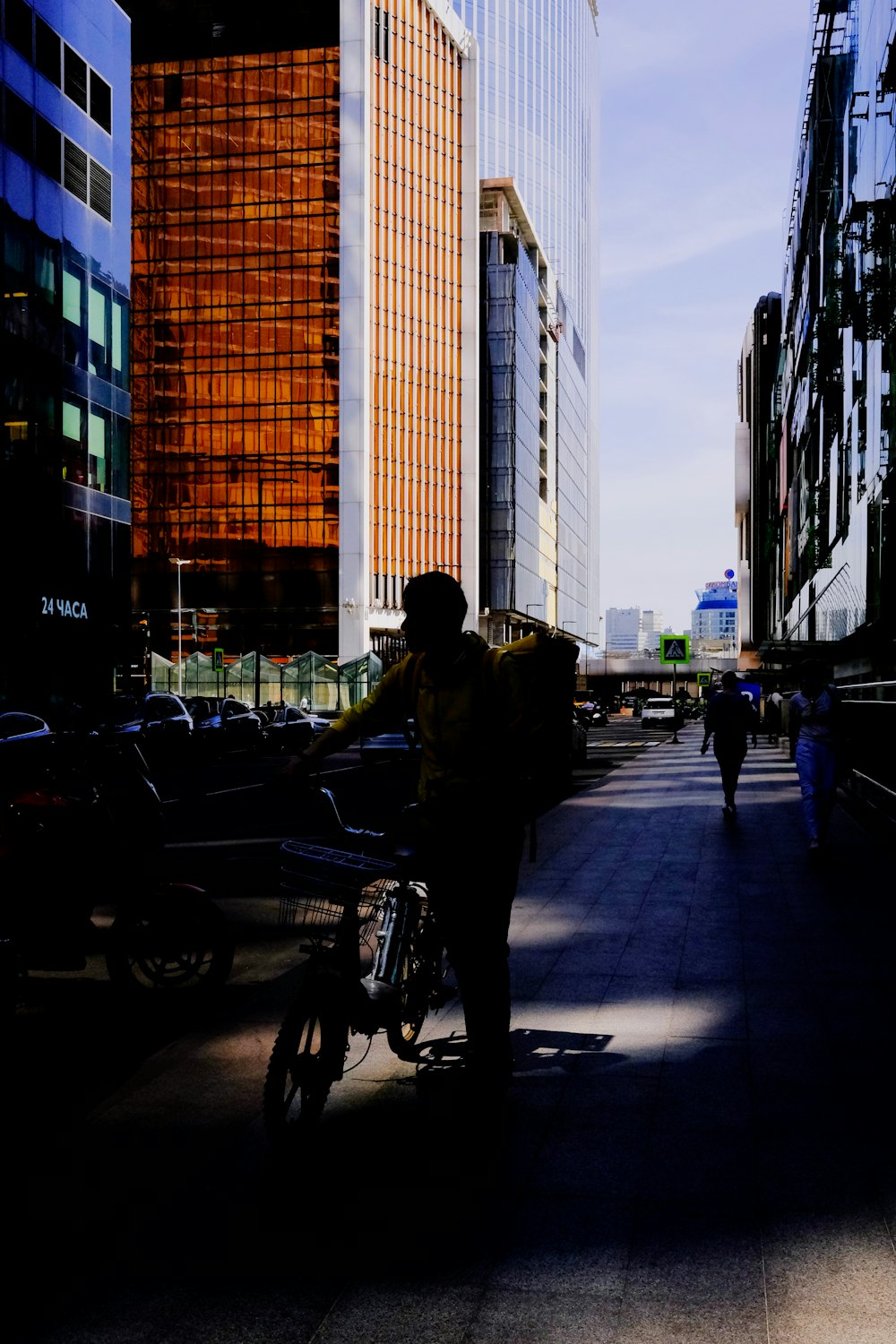 man in black jacket and pants riding on motorcycle on road during daytime