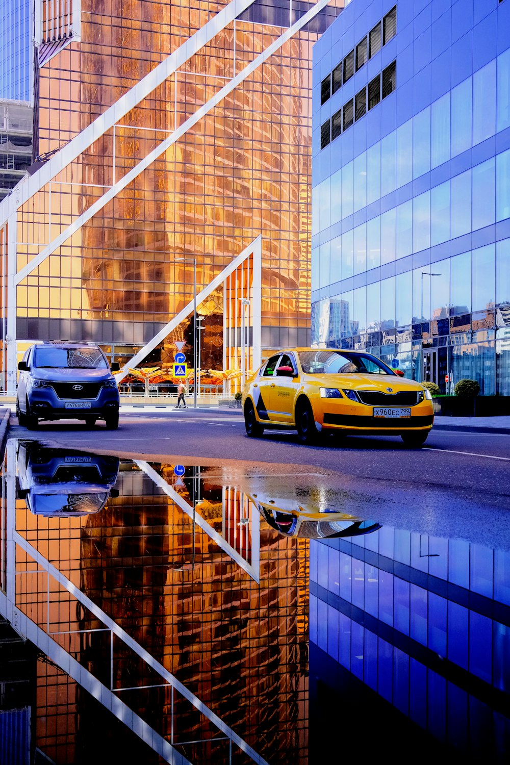 yellow and black cars on road during daytime