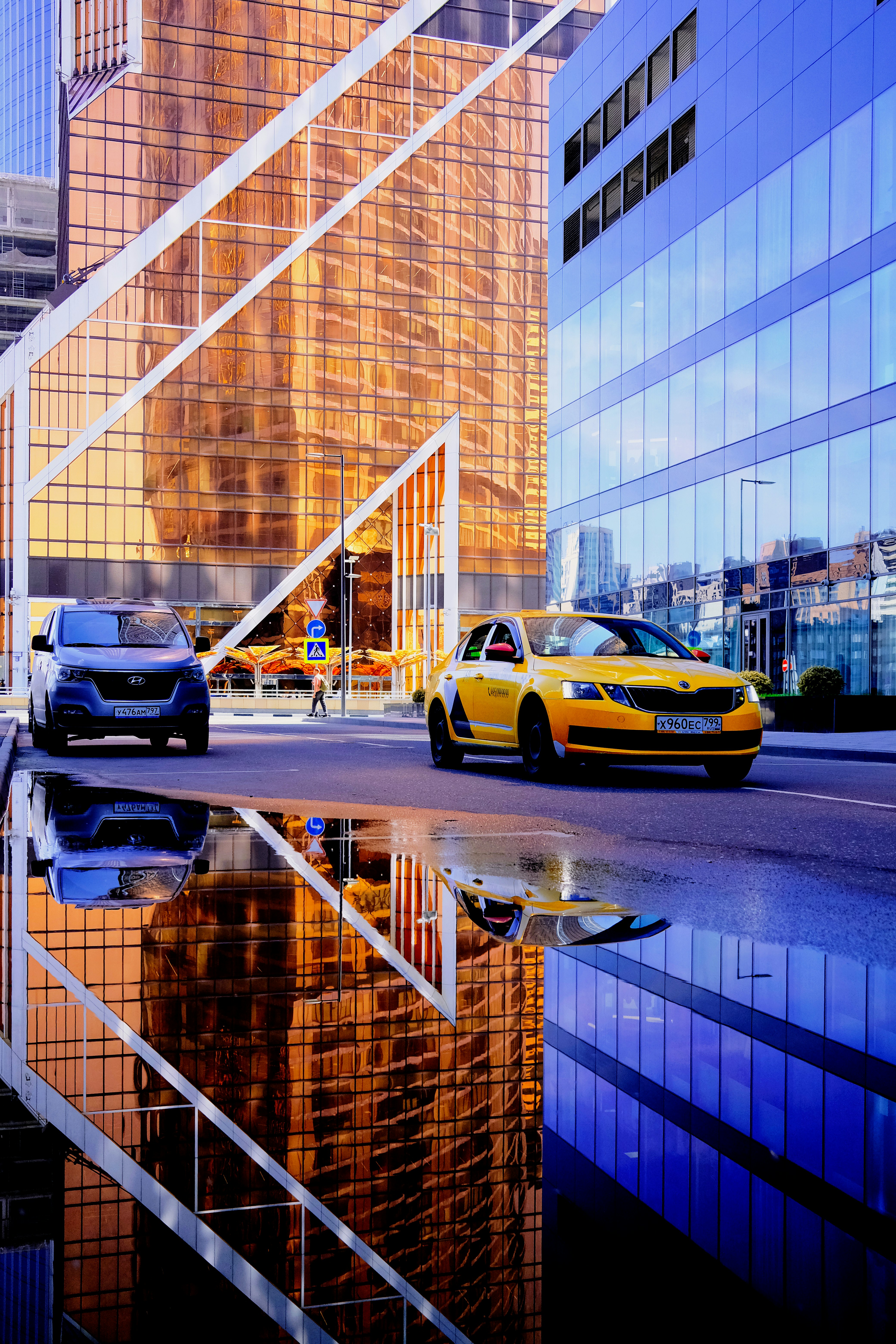 yellow and black cars on road during daytime