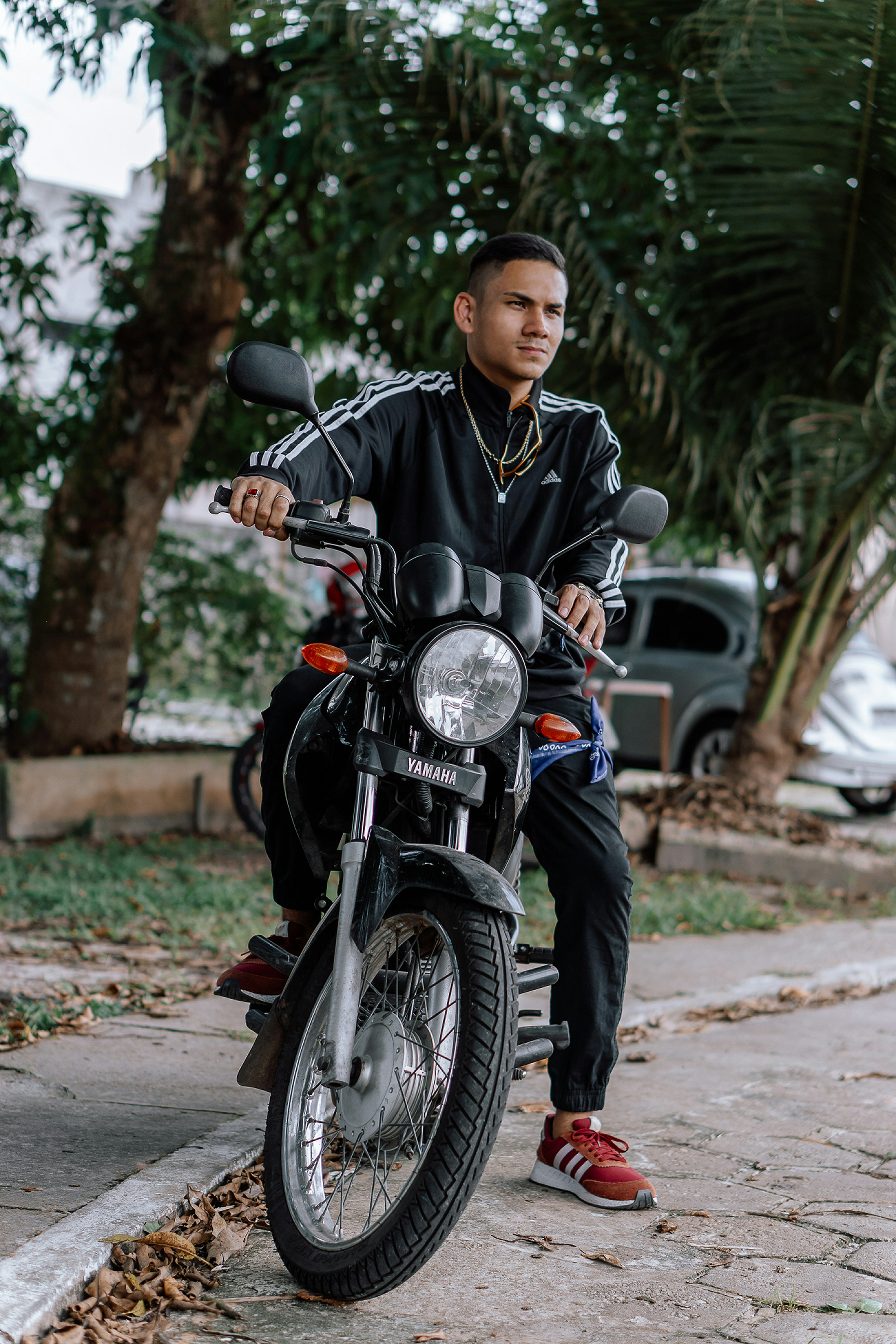 man in black and white stripe jacket riding black motorcycle