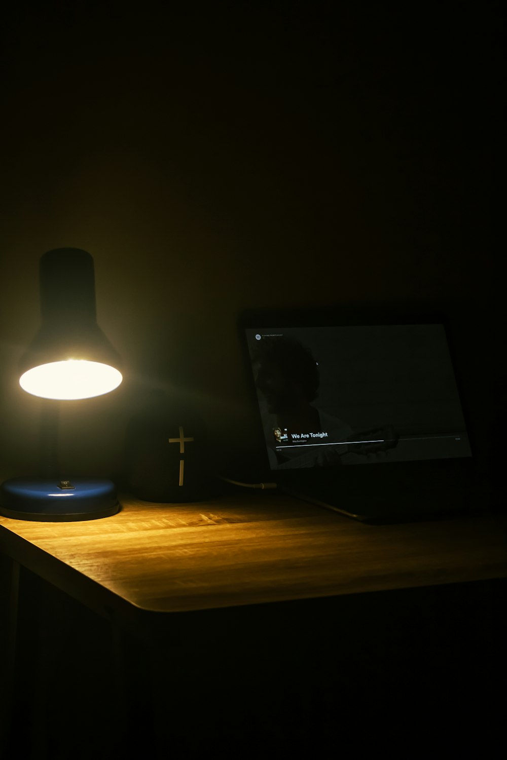 black flat screen computer monitor on brown wooden desk