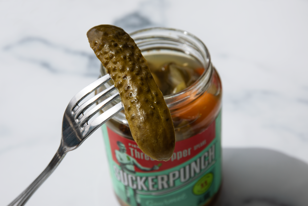 stainless steel fork on green labeled can