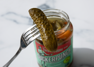 stainless steel fork on green labeled can