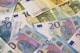 20 euro bill on white and blue textile