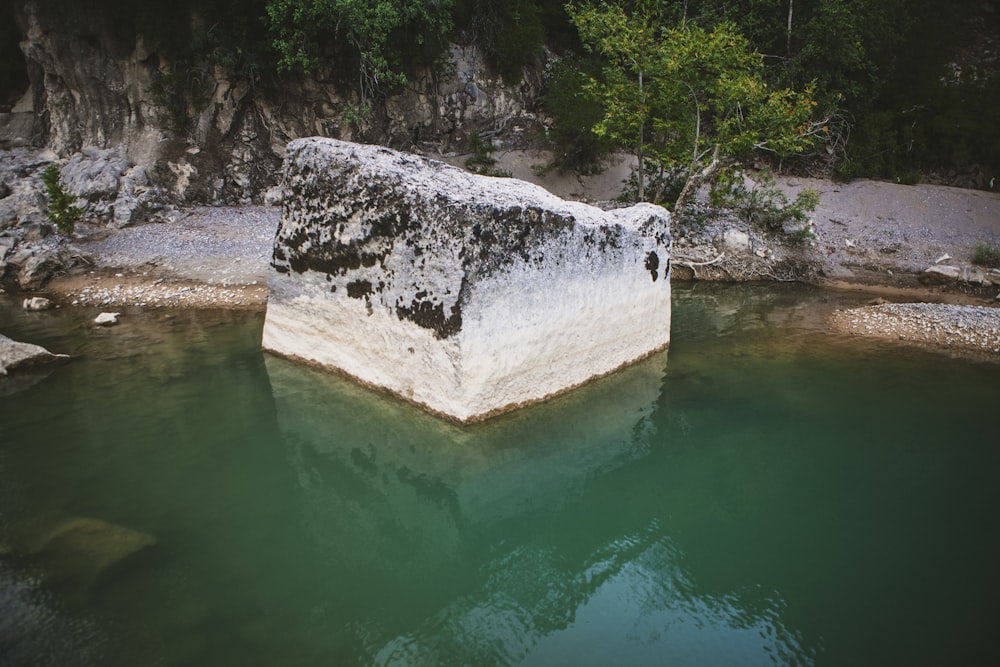 white rock formation on water