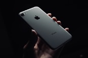 person holding silver iphone 6