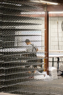 Industrial protective sleeves and aprons arranged neatly on a table.