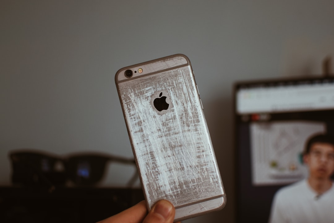 person holding silver iphone 6