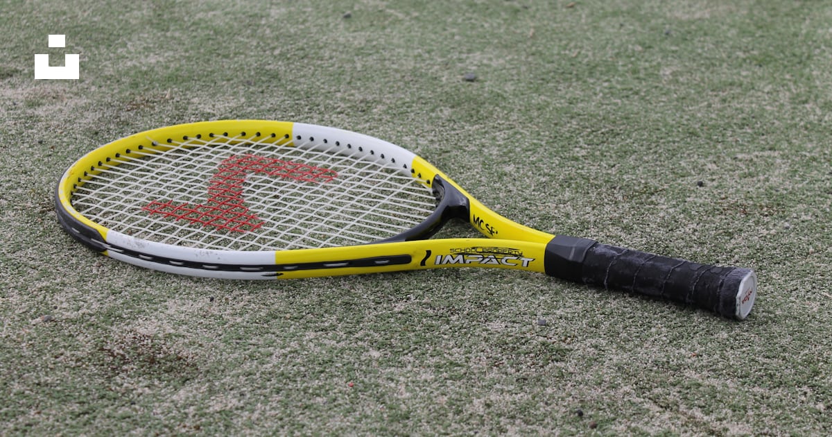 Yellow and black tennis racket on green grass field photo – Free Racket ...