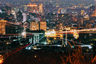city with high rise buildings during night time