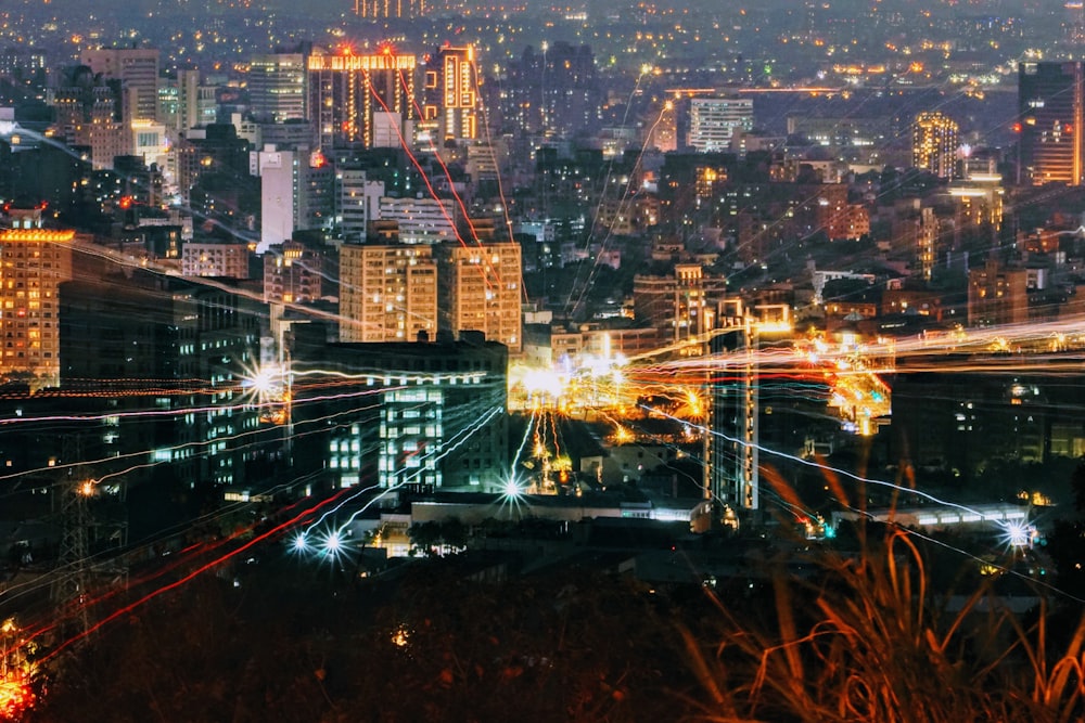 city with high rise buildings during night time