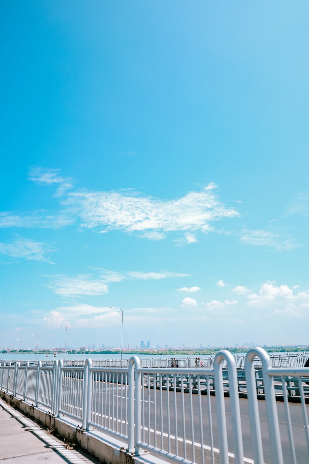 white metal fence under blue sky during daytime