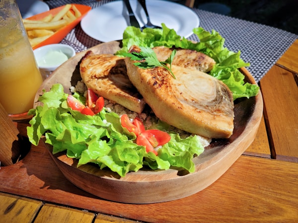Brown bread on brown wooden round plate