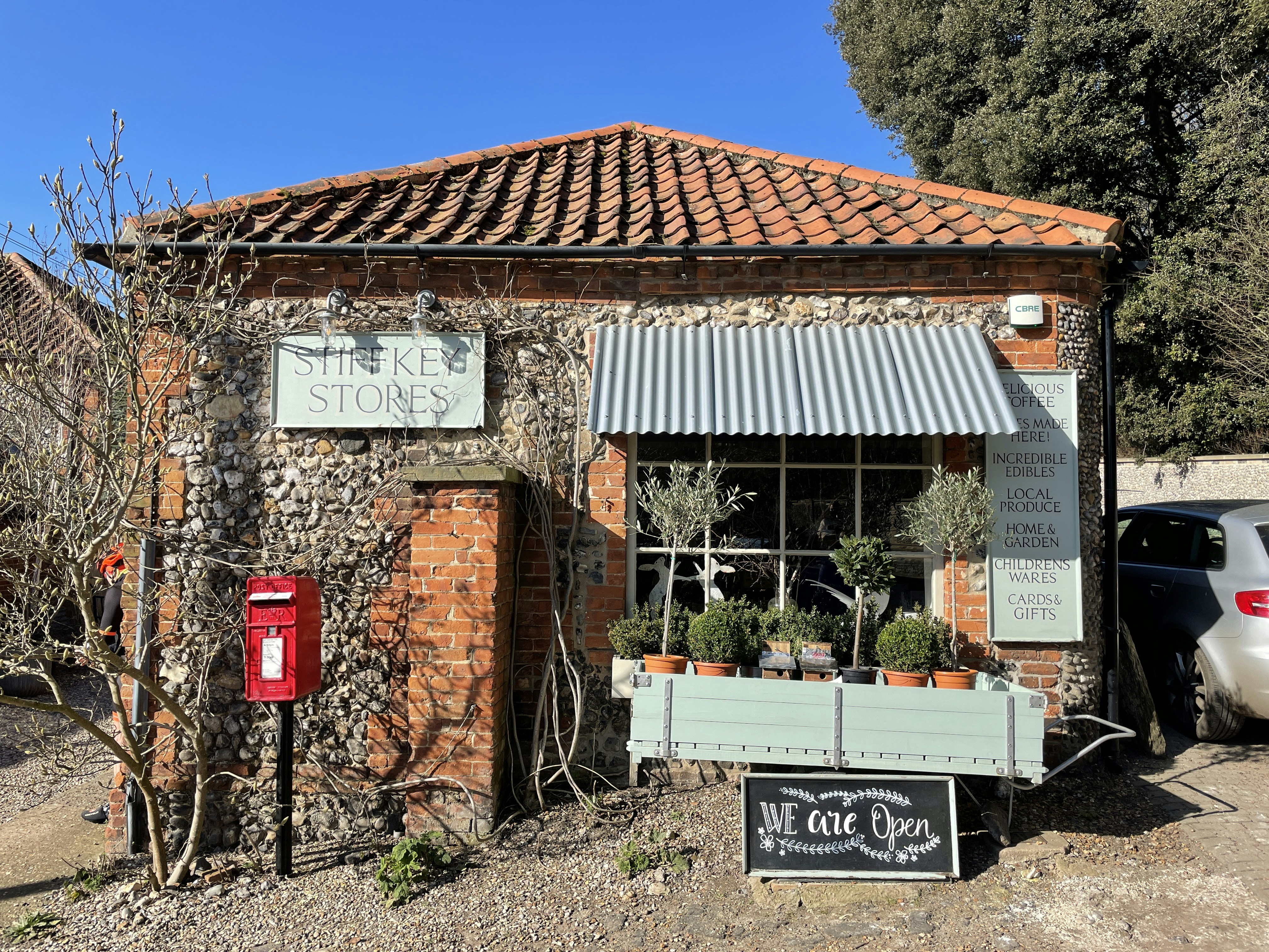 brown brick building with red signage