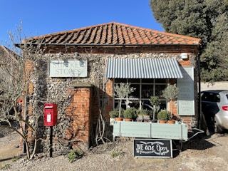 A cozy, inviting private post office counter with friendly staff assisting customers.