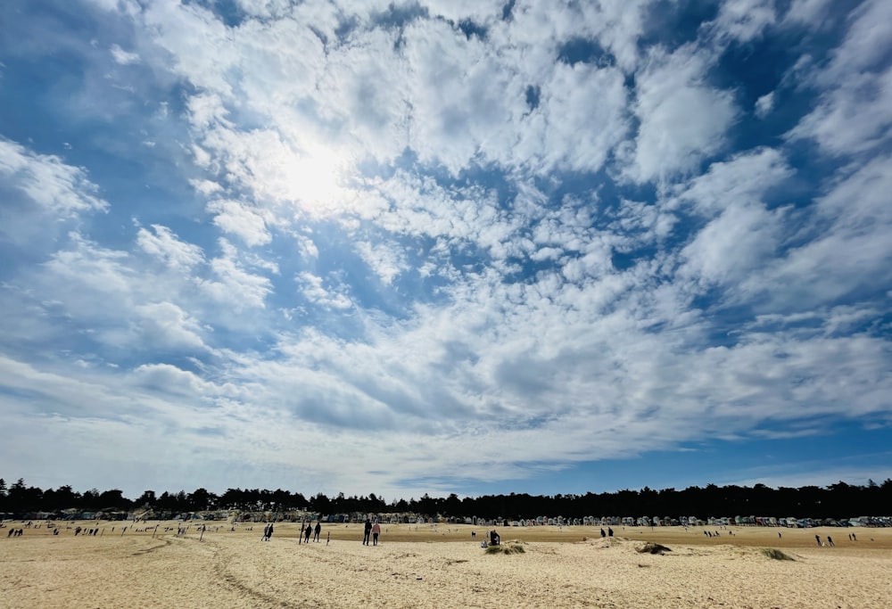 white clouds over brown field