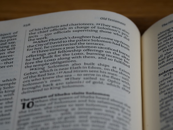 A close-up view of an open book with text in English. The focus is on a passage discussing biblical events and figures, specifically mentioning Solomon and the sacrifices made. The text is printed in a clear, serif font, and the page number 258 is visible at the top.