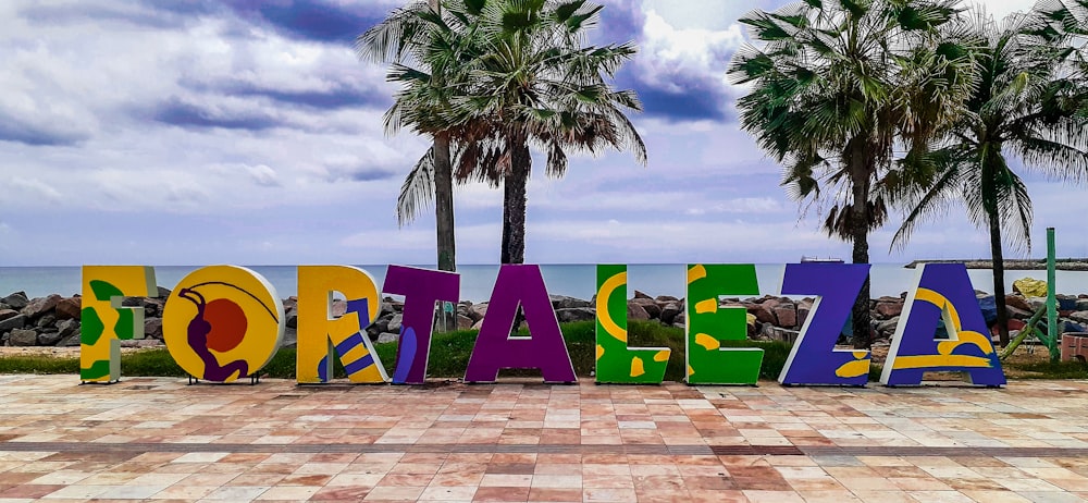 people sitting on green chairs near beach during daytime