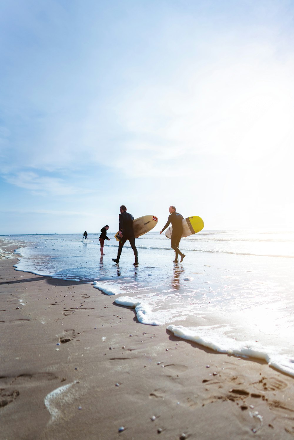 people walking on beach during daytime