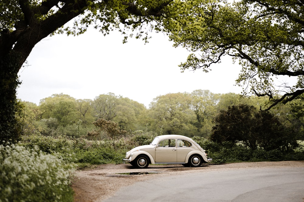 white coupe on road during daytime