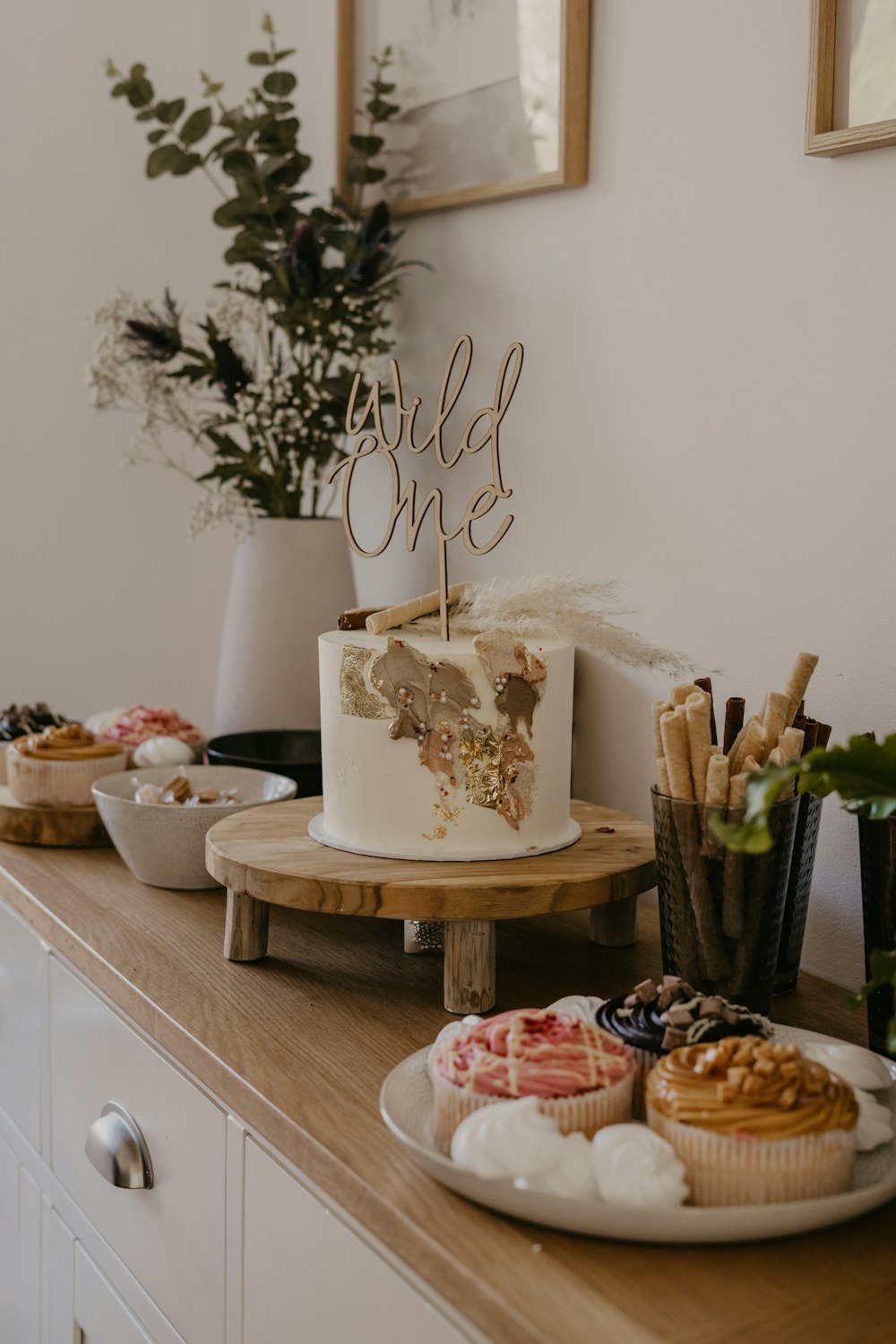 white and brown cake on brown wooden table