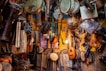 brown wooden guitar hanging on wall