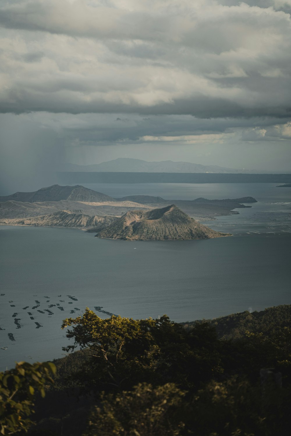 aerial view of mountain near body of water during daytime