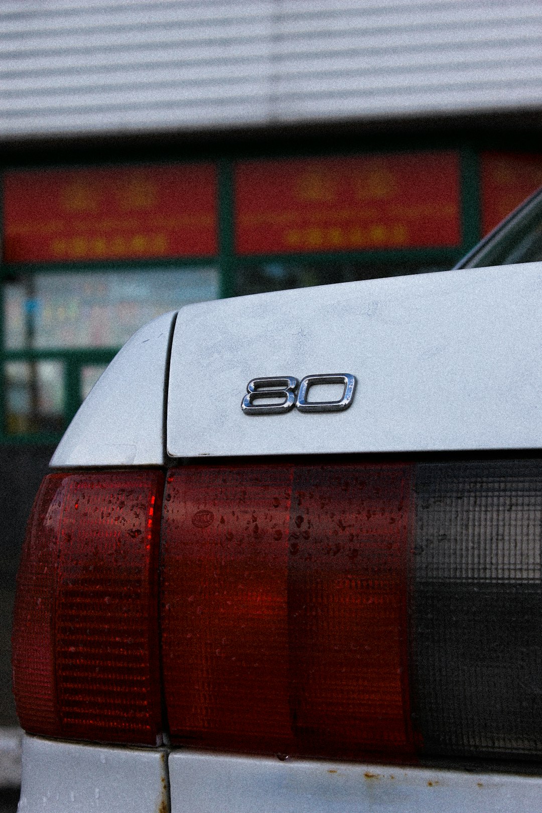 white mercedes benz car in front of building