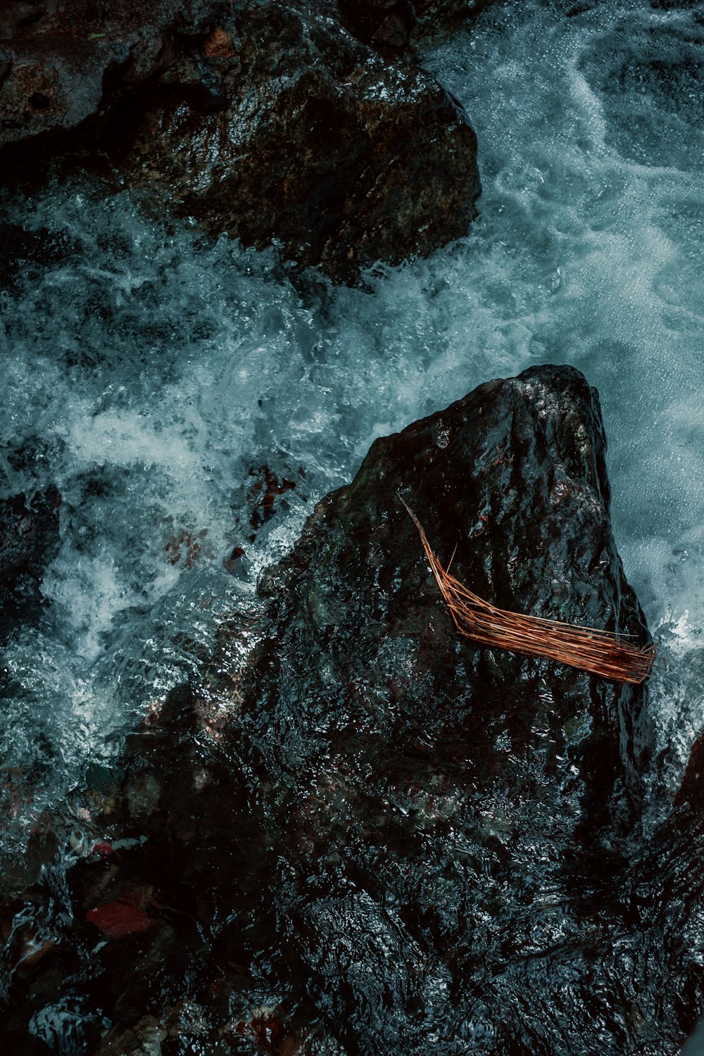 water waves hitting rocky shore during daytime