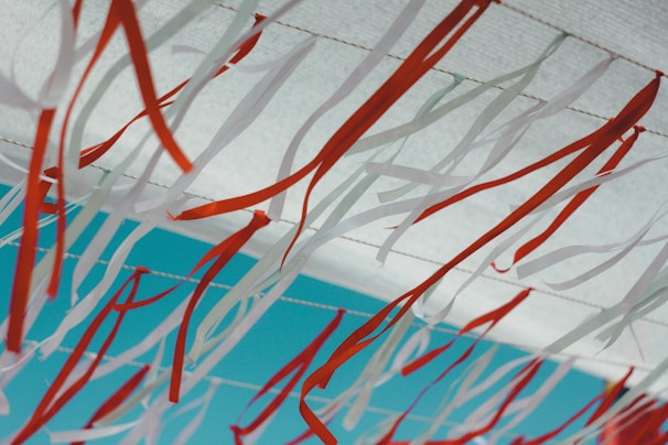 Bright party balloons and festive ribbons hanging from the ceiling, ready for celebration.