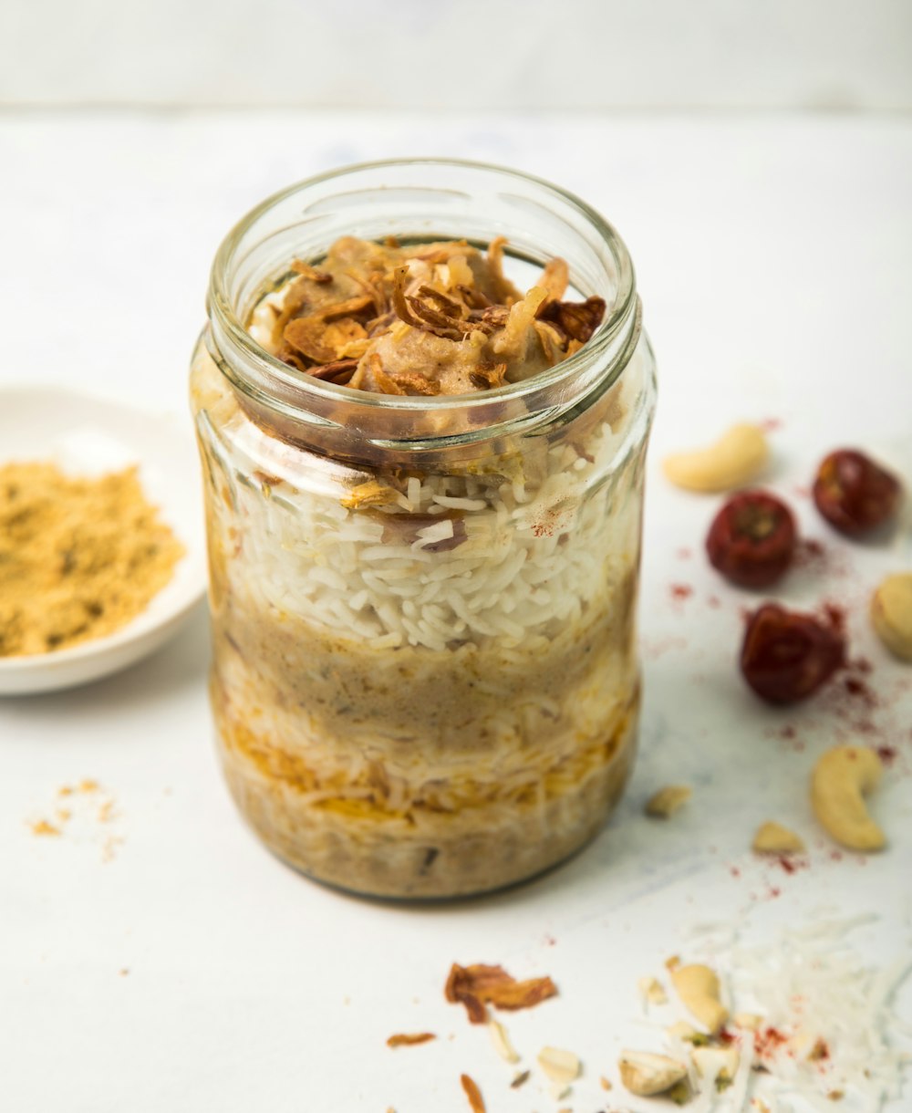 clear glass jar with white cream