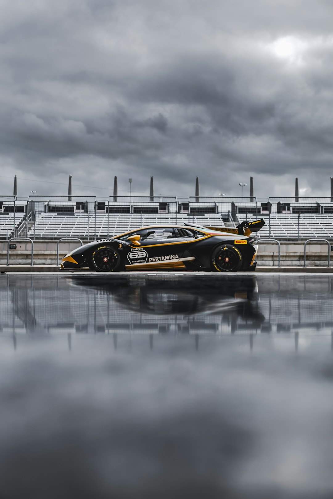 yellow and black racing car on road during daytime